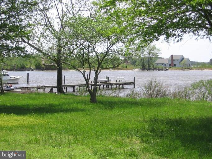 5154 Paw Paw Road Cambridge, MD 21613 - Photo 8 of 24 Neighbor's pier