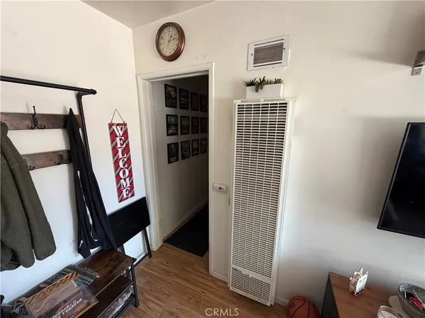 a view of entryway with wooden floor