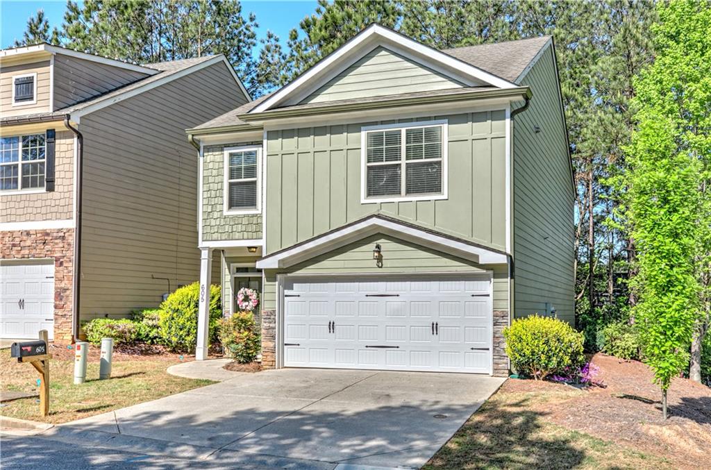 605 Summit Point Canton, GA 30114 - Photo 4 of 56 a front view of a house with garden