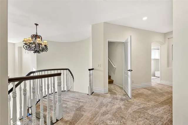 a view of a hallway to a bedroom