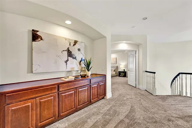 a spacious bathroom with a sink and mirror