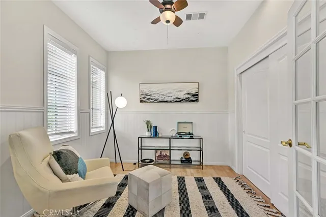 a bathroom with a granite countertop toilet sink and mirror