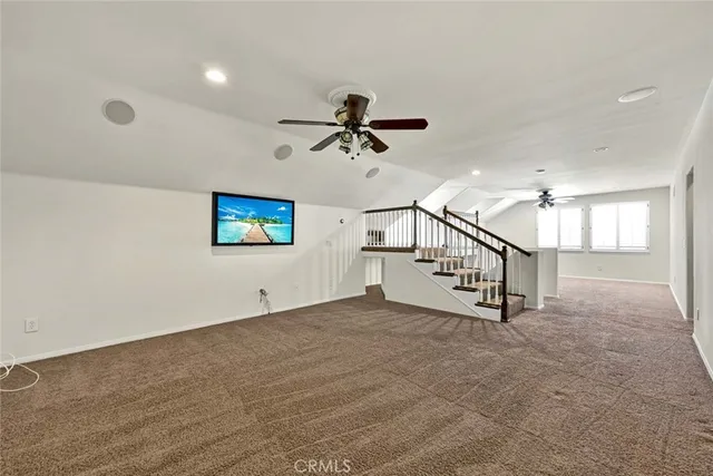 a view of a patio with table and chairs and potted plants