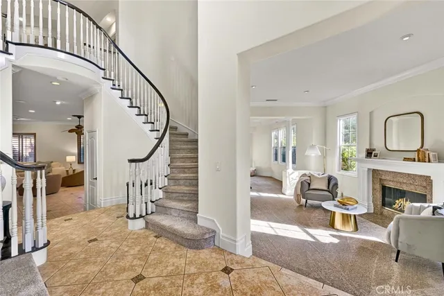 a view of entryway livingroom and hall with wooden floor