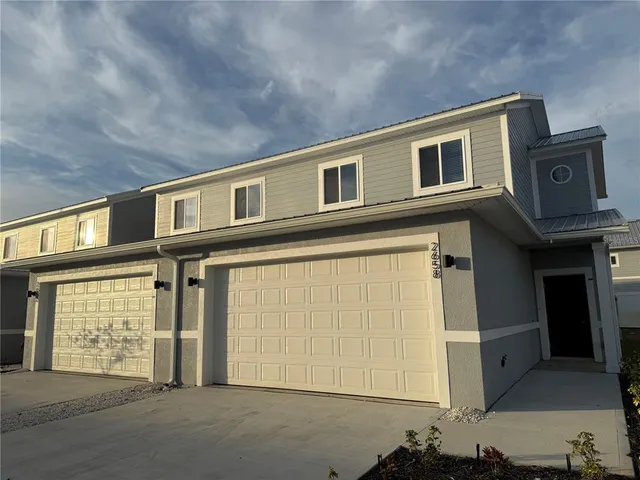 a front view of a house with a garage