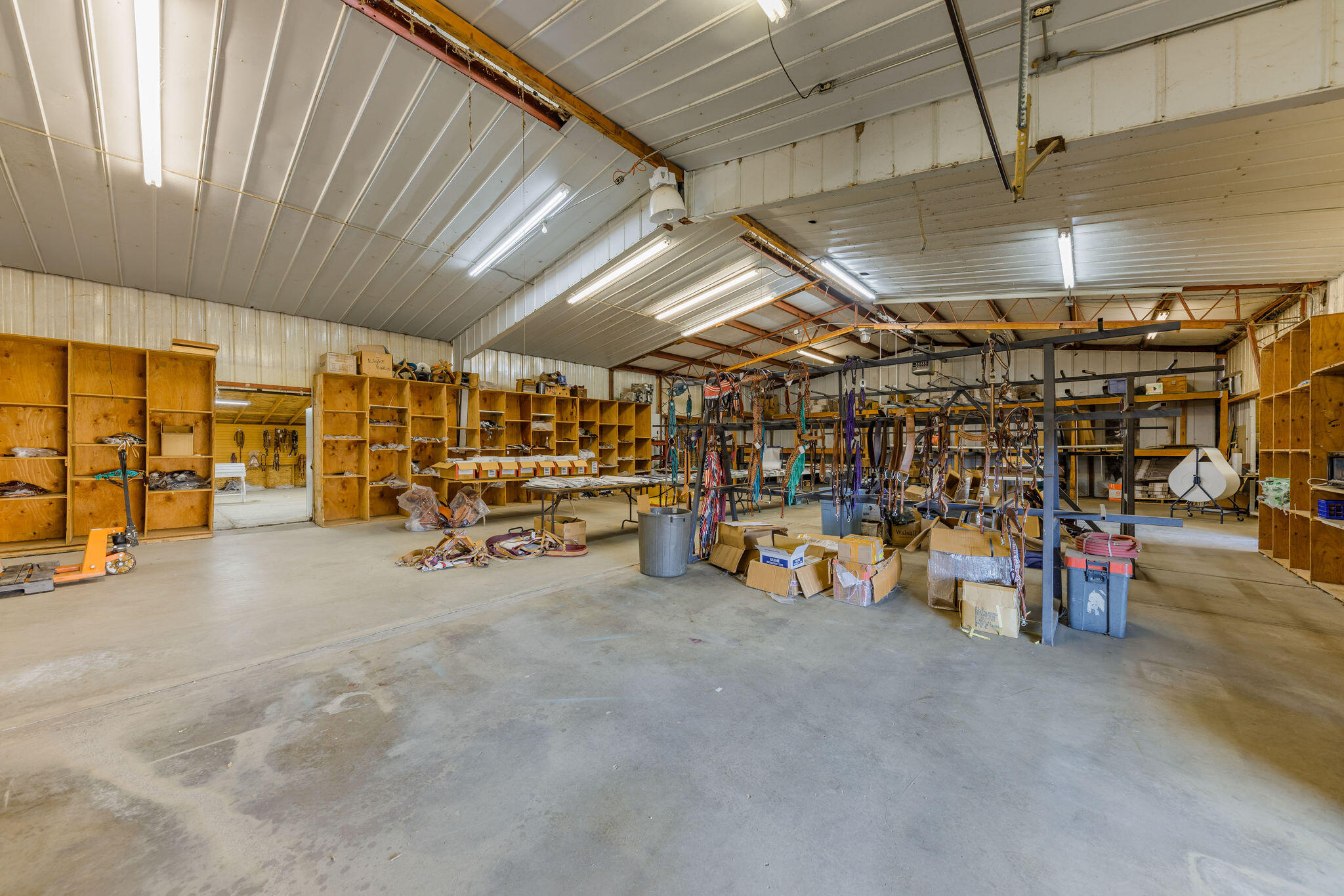 6790 Holland Loop Road Cave Junction, OR 97523 - Photo 58 of 151 a view of a garage with a table and chairs