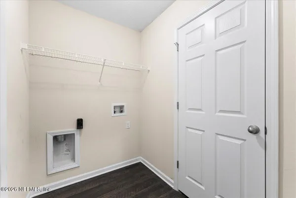 an empty room with closet area