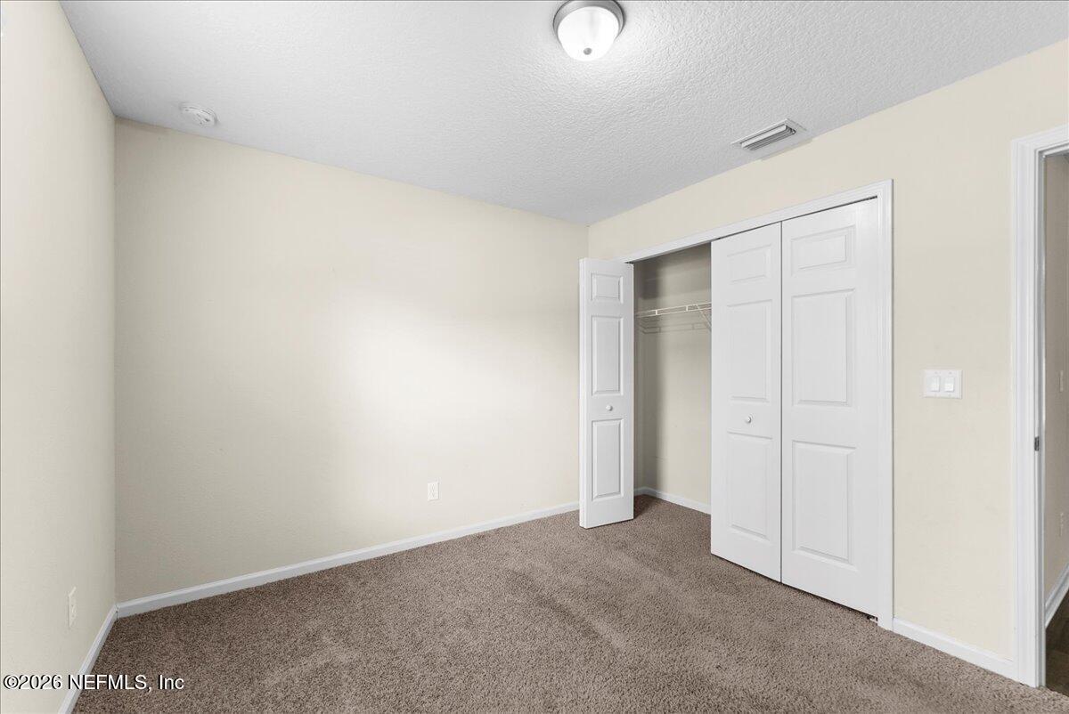 2383 Daisy Street Middleburg, FL 32068 - Photo 12 of 33 an empty room with closet area