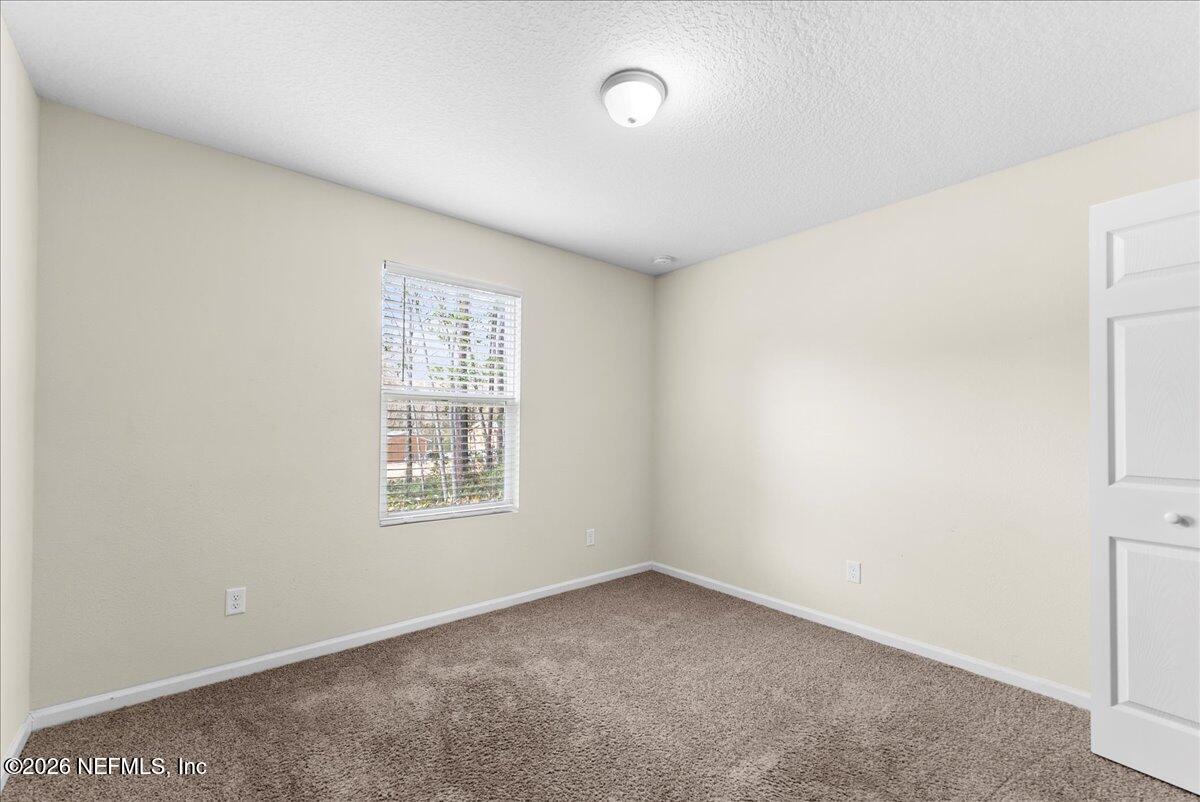 2383 Daisy Street Middleburg, FL 32068 - Photo 13 of 33 an empty room with a window