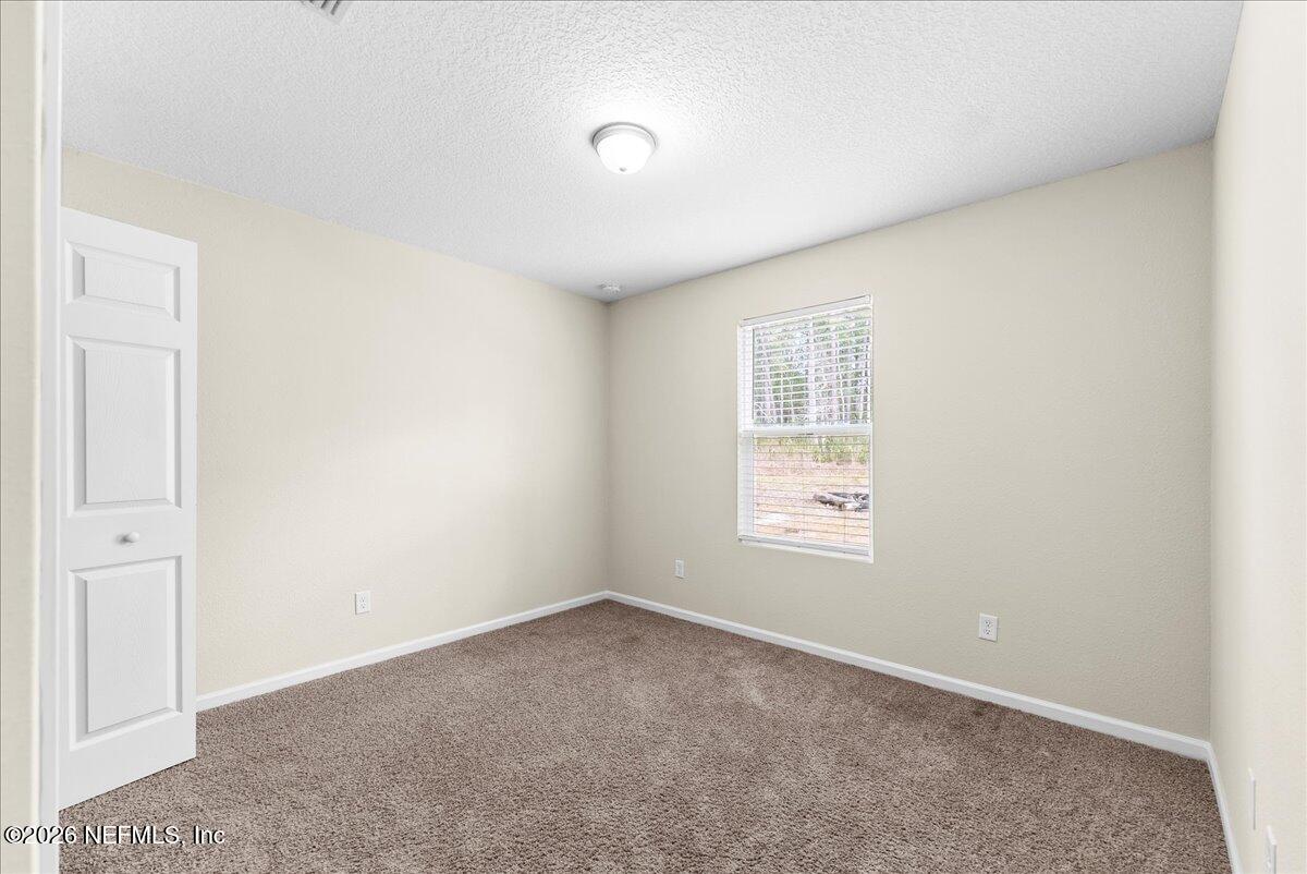 2383 Daisy Street Middleburg, FL 32068 - Photo 17 of 33 an empty room with windows