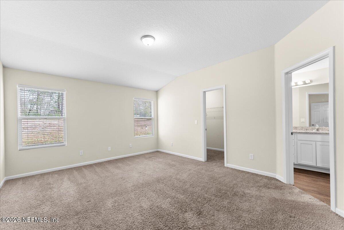 2383 Daisy Street Middleburg, FL 32068 - Photo 19 of 33 a view of an empty room with closet and a window