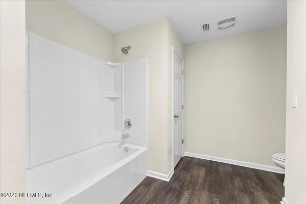 a bathroom with a bathtub and a sink