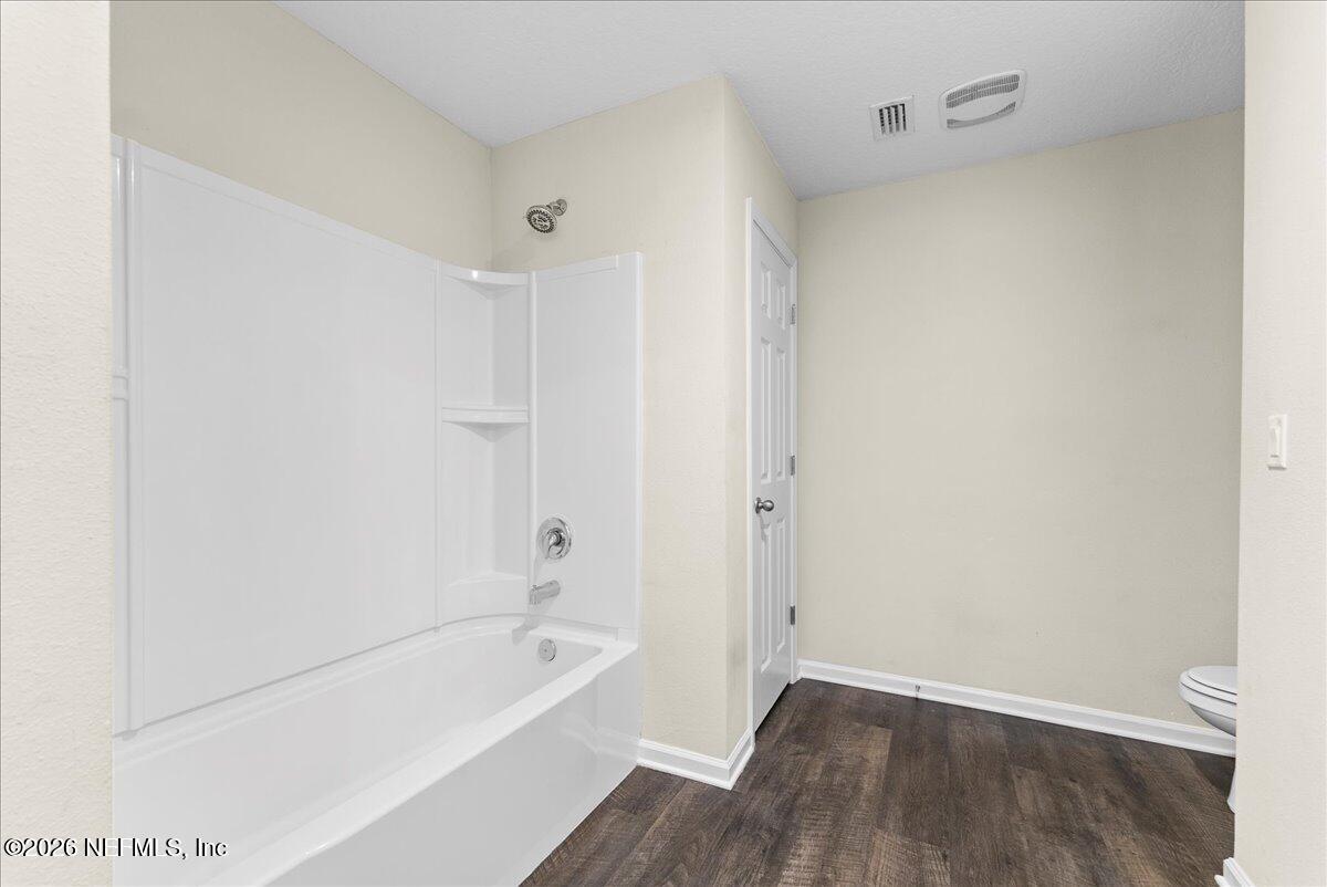 2383 Daisy Street Middleburg, FL 32068 - Photo 23 of 33 a bathroom with a bathtub and a shower