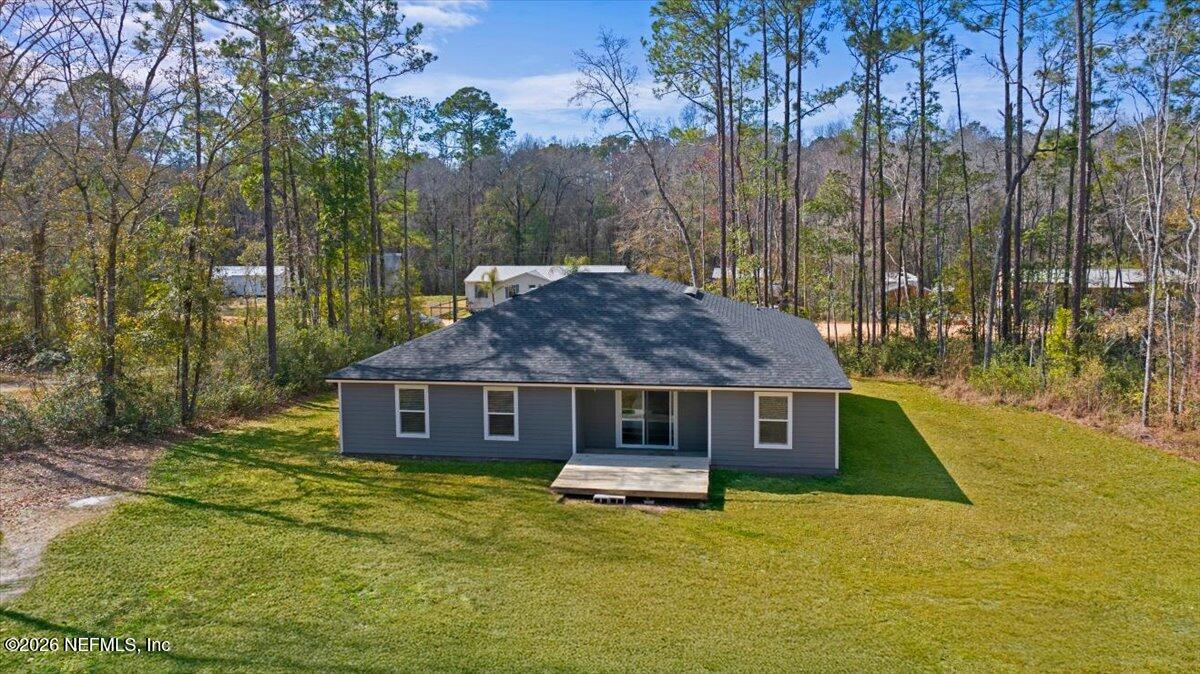 2383 Daisy Street Middleburg, FL 32068 - Photo 29 of 33 a front view of a house with a yard