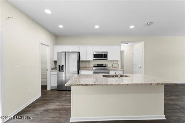 a view of small space with wooden floor