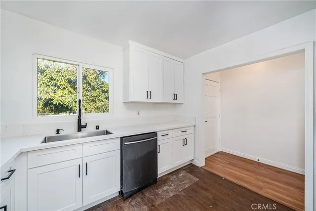 a kitchen with stainless steel appliances a refrigerator sink and stove