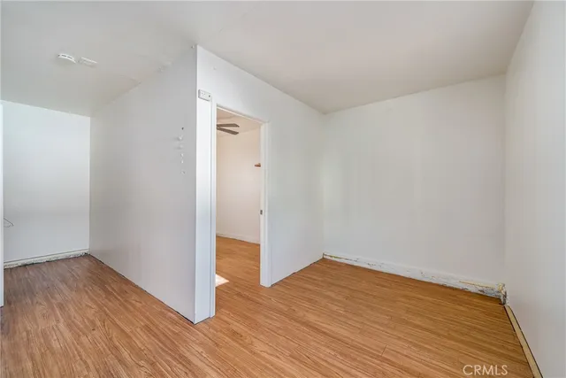 a room with cabinets and wooden floor