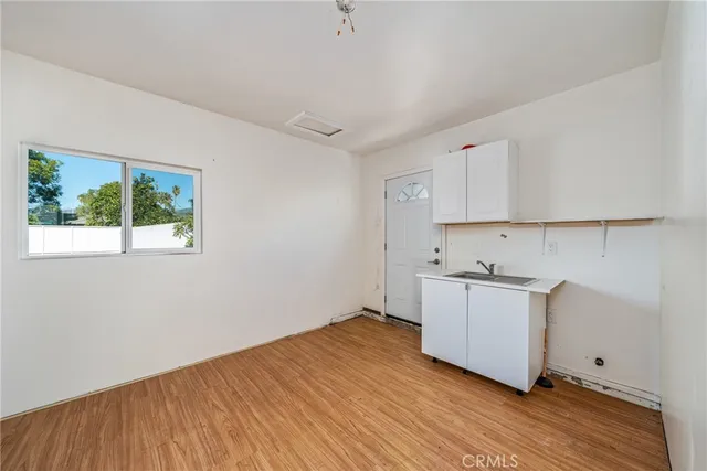 a bathroom with a toilet sink and a mirror