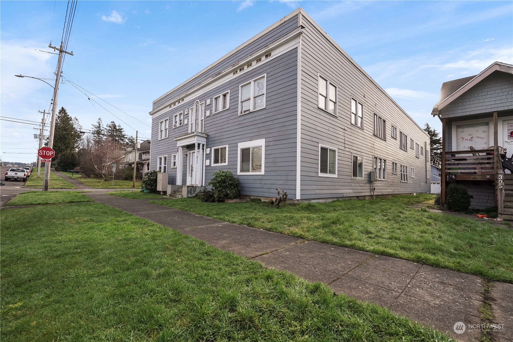 301 West 3rd Street Aberdeen, WA 98520 - Photo 1 of 15 a view of a house with a backyard