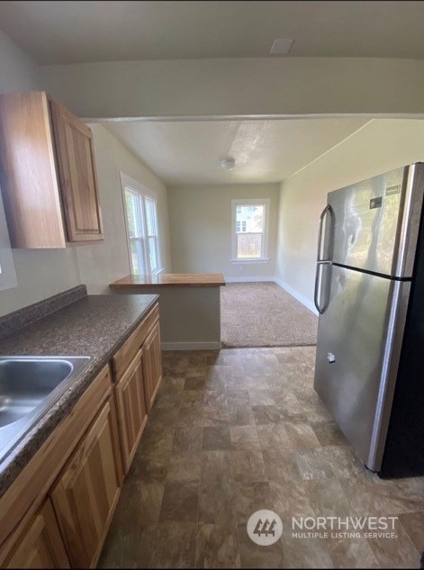 301 West 3rd Street Aberdeen, WA 98520 - Photo 11 of 15 a view of a kitchen with a sink and dishwasher