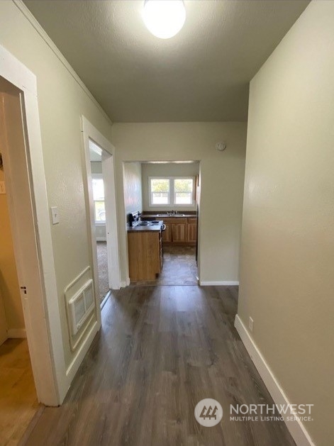301 West 3rd Street Aberdeen, WA 98520 - Photo 14 of 15 a view of empty room with wooden floor