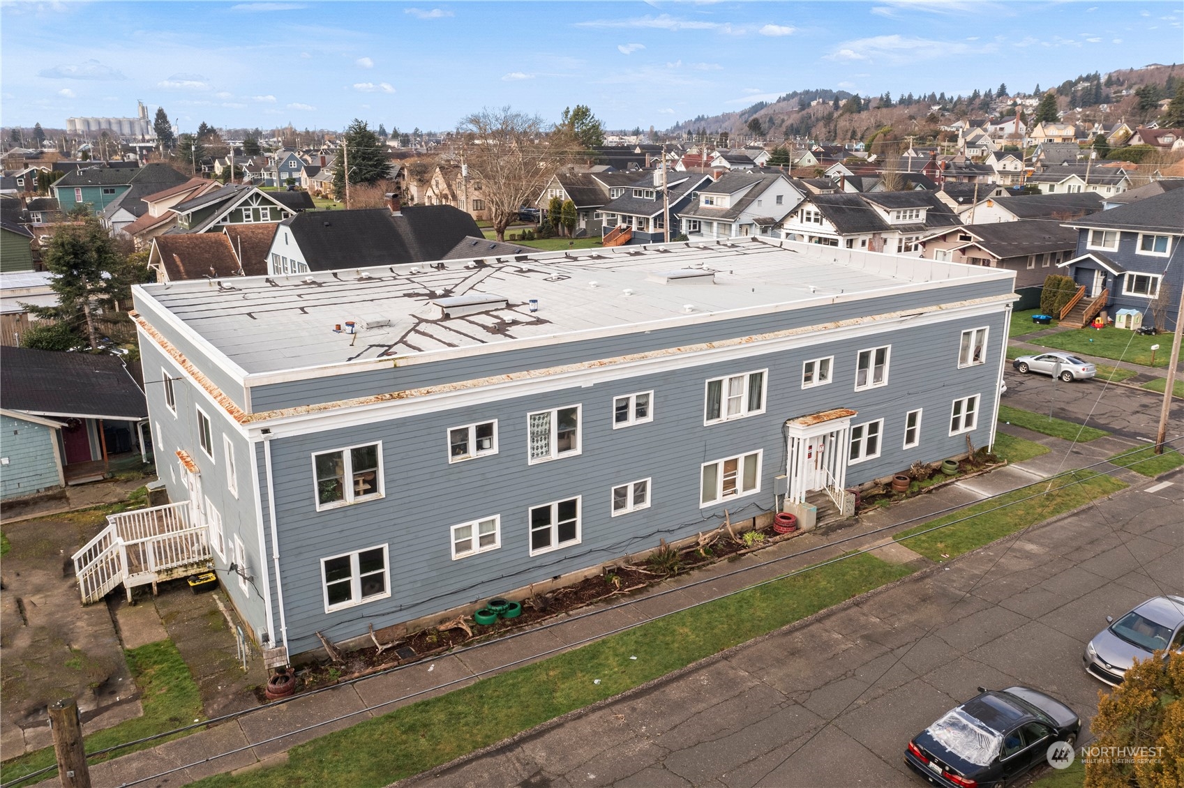 301 West 3rd Street Aberdeen, WA 98520 - Photo 8 of 15 an aerial view of a house with a yard