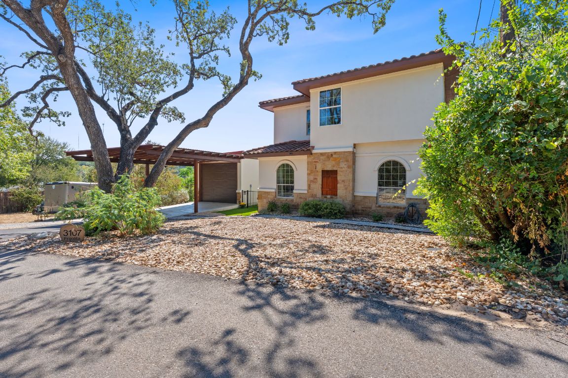 a view of a house with a tree