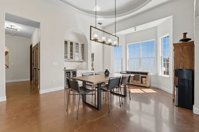 a spacious bedroom with a bed and a table