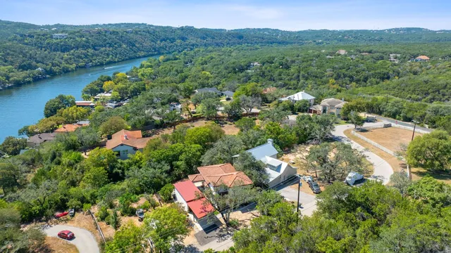 an aerial view of a house with a yard