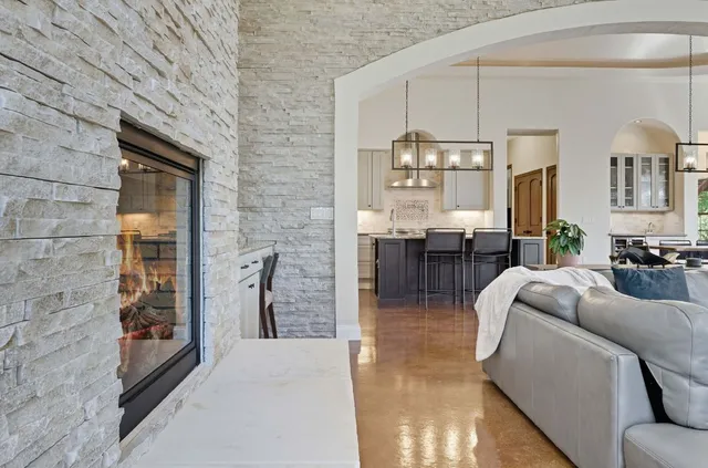 a kitchen with stainless steel appliances granite countertop a stove and a refrigerator
