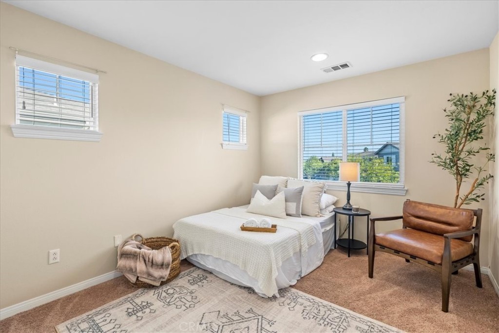 17557 Buttonwood Lane Carson, CA 90746 - Photo 16 of 43 a bedroom with a bed and a window