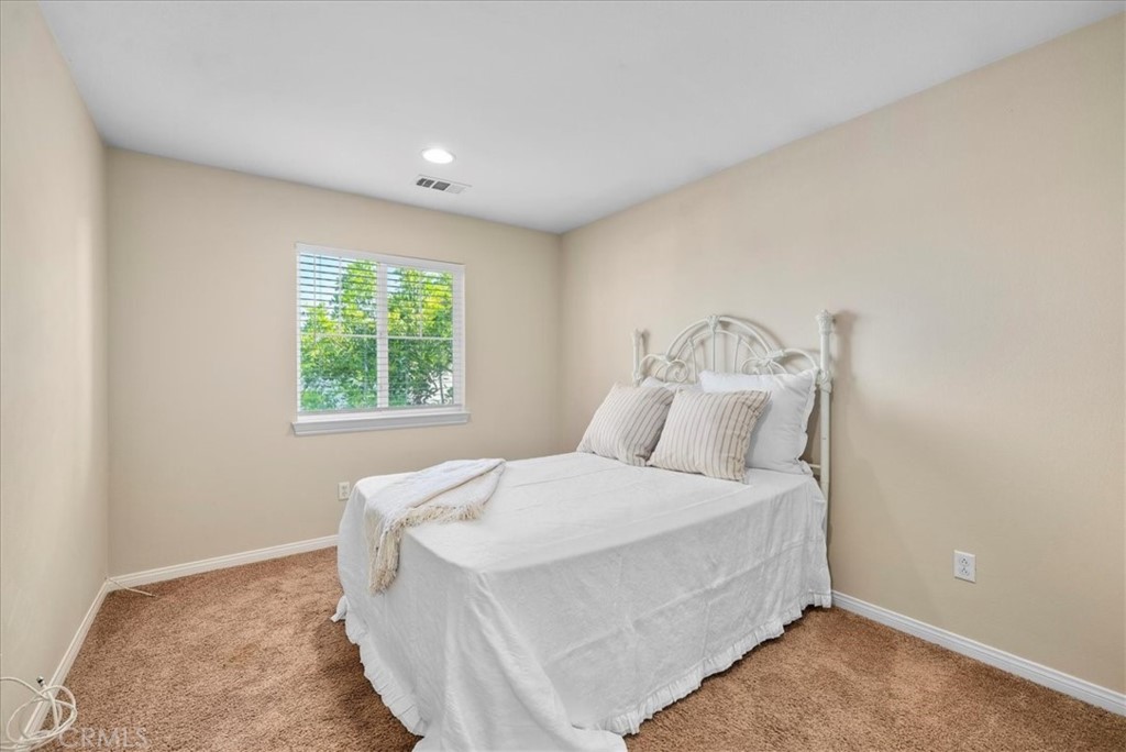 17557 Buttonwood Lane Carson, CA 90746 - Photo 20 of 43 a bedroom with a bed and a window