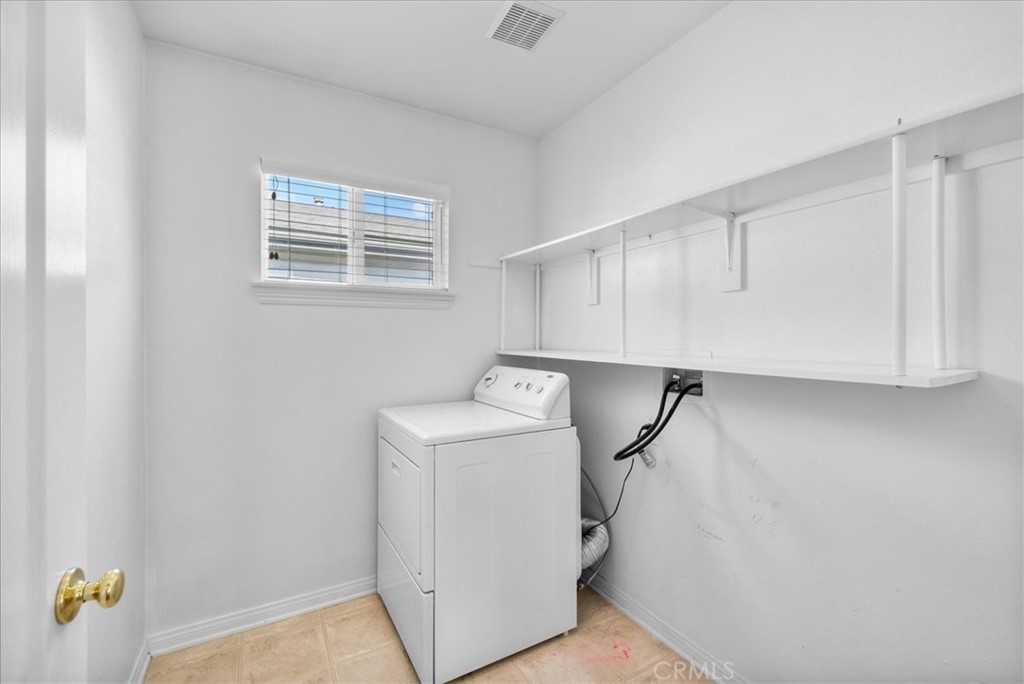 17557 Buttonwood Lane Carson, CA 90746 - Photo 24 of 43 a view of storage and utility room with washer and dryer