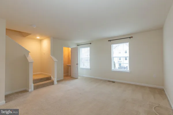 a view of a bathroom from a hallway