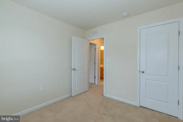 a view of a hallway with windows