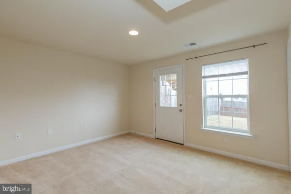a view of an empty room and closet area