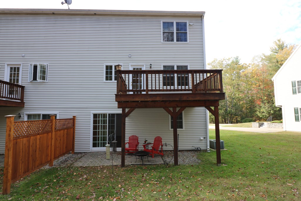 68 Brookfield Road, Unit 202 Charlton, MA 01507 - Photo 12 of 13 a view of a chairs setting in the backyard