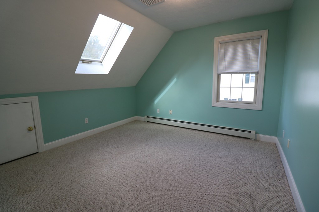 68 Brookfield Road, Unit 202 Charlton, MA 01507 - Photo 7 of 13 an empty room with a window