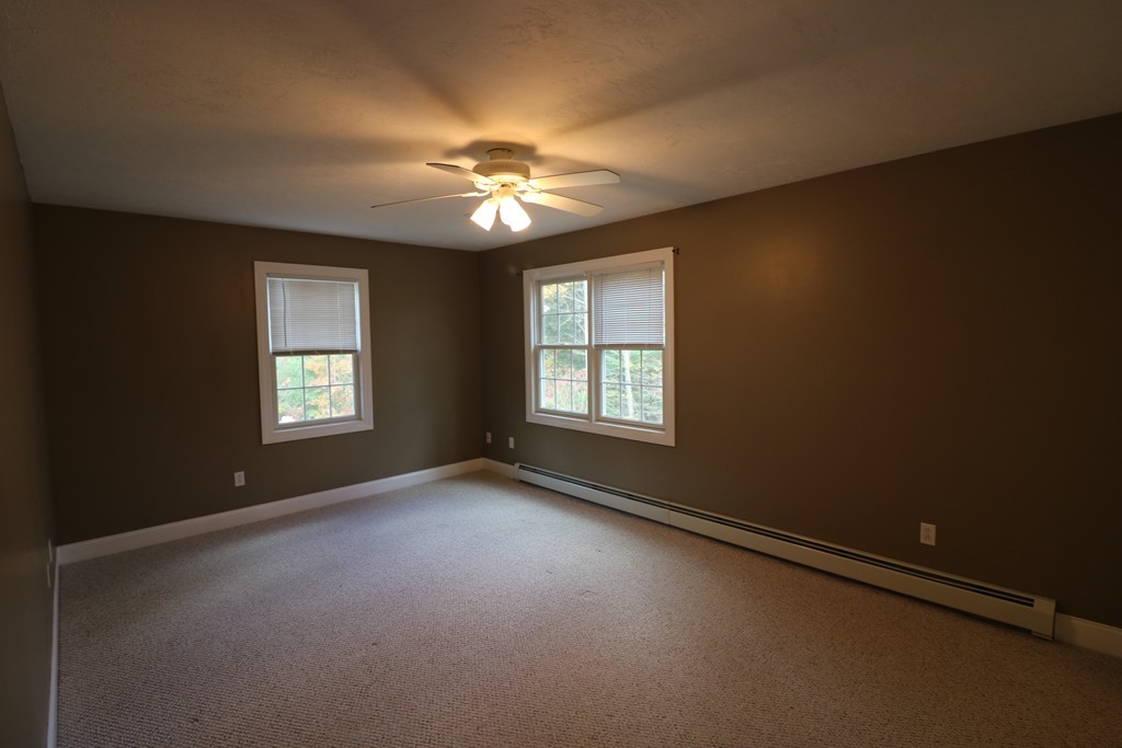 68 Brookfield Road, Unit 202 Charlton, MA 01507 - Photo 8 of 13 a view of an empty room with a window
