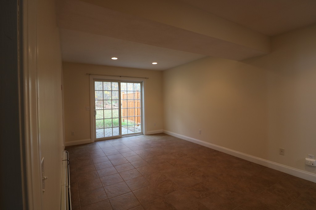 68 Brookfield Road, Unit 202 Charlton, MA 01507 - Photo 10 of 13 a view of an empty room with a window