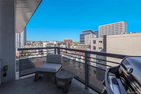 a view of a balcony with chairs