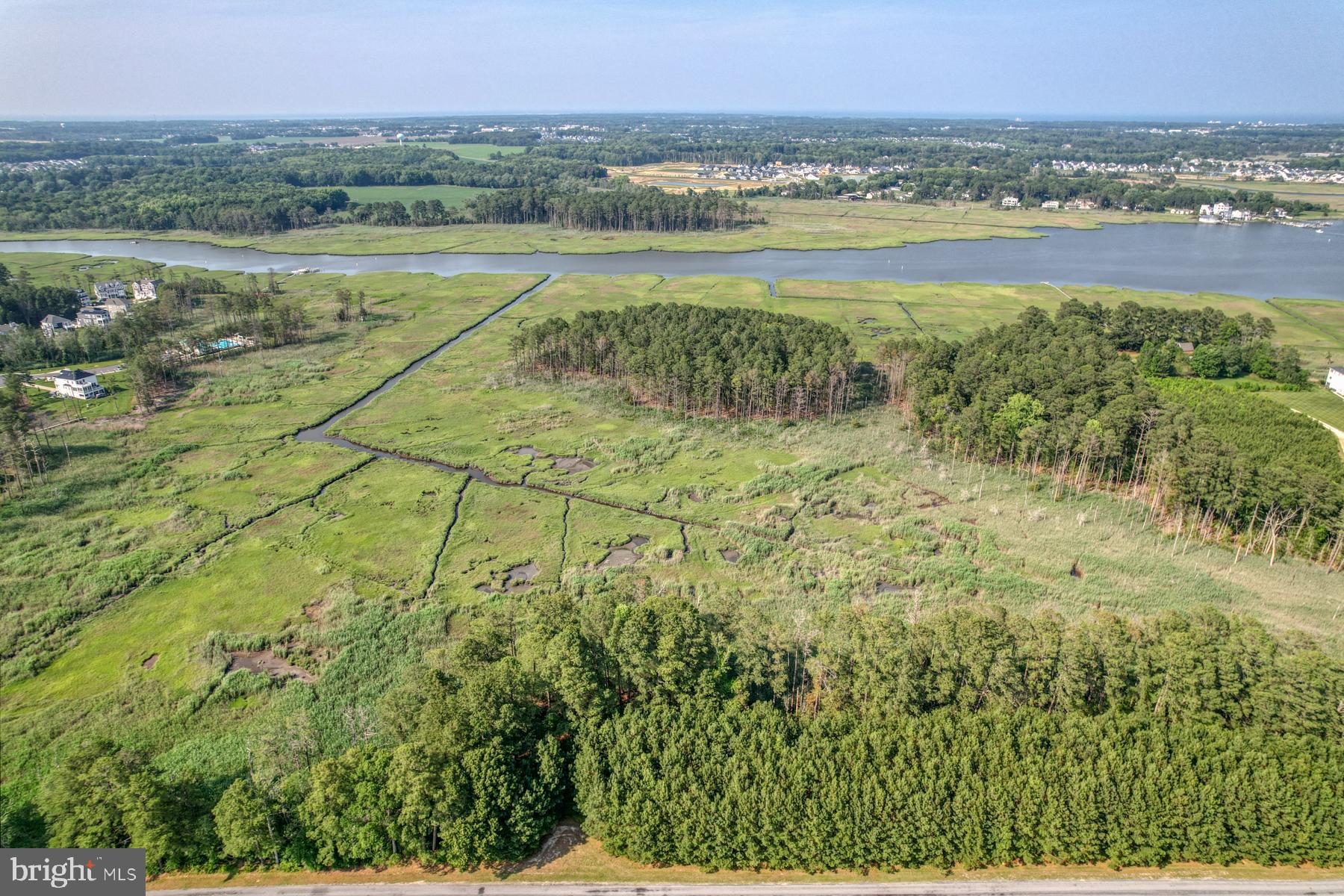 22253 Waterview Road, Unit 4 Lewes, DE 19958 - Photo 4 of 28 a view of a lake with a mountain in the background
