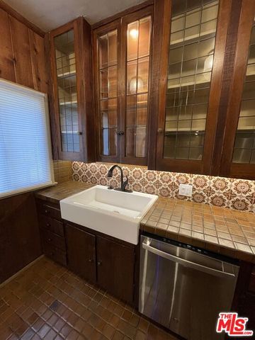 a kitchen with a sink and a refrigerator