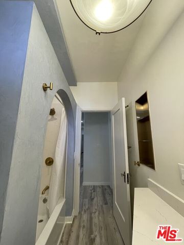 a bathroom with a tub and a shower