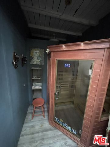 a bathroom with a shower and a sink