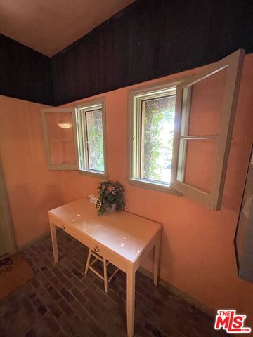 a workspace with furniture and window