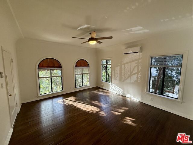 a view of livingroom and hardwood floor