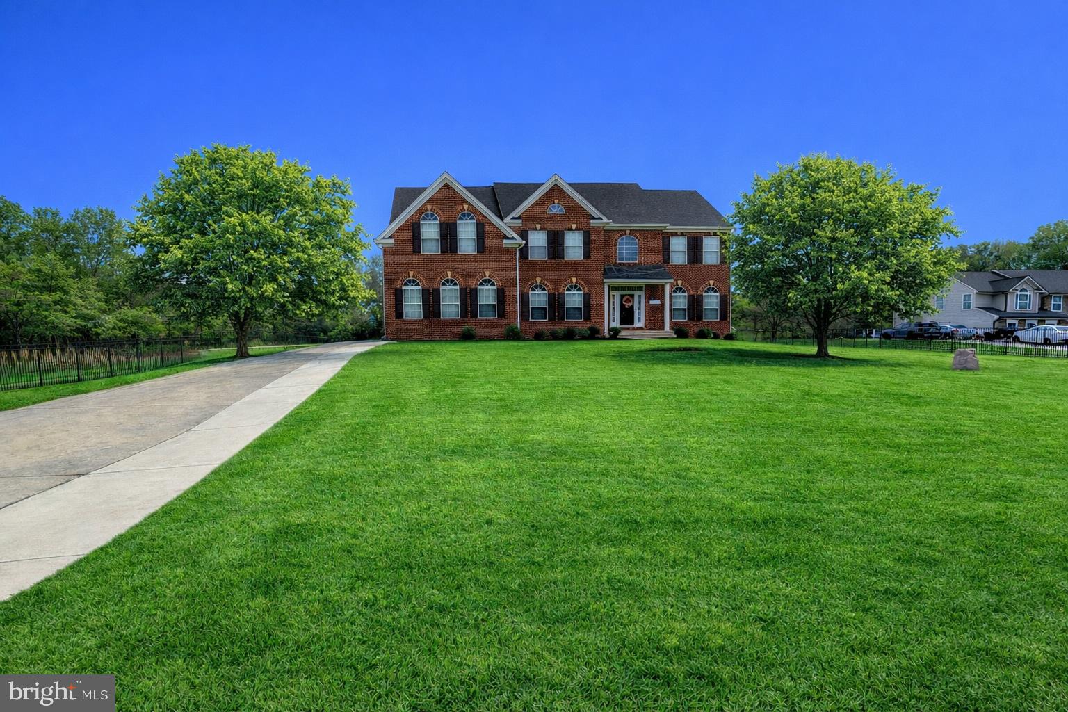 14204 Highlands Terrace Accokeek, MD 20607 - Photo 1 of 4 a view of a big house with a big yard