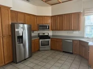 a view of a room that has a window and couch