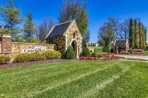 a view of a field with an trees in the background